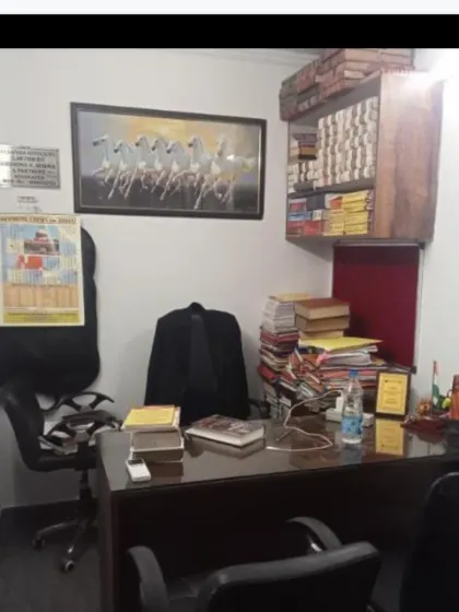A view of my chamber, where strategy is formulated and cases are meticulously prepared. The extensive library and case files are a testament to our thorough research process for every matter we undertake.