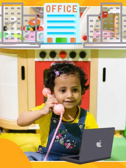 Taking care of business! This little entrepreneur is making important calls from her "office" in our imaginative play corner.