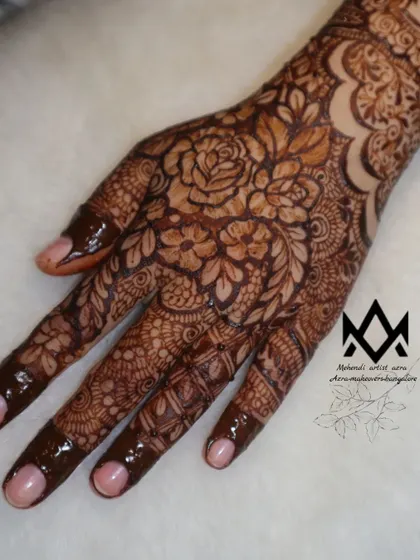 A detailed shot of the palm in this floral design, highlighting the intricate shading and linework.