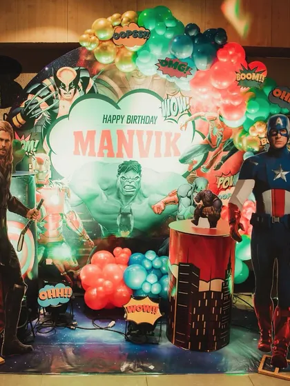 An epic Avengers superhero theme! The backdrop features Hulk, Thor, and Captain America, creating a powerful and exciting setting for a young fan's birthday.