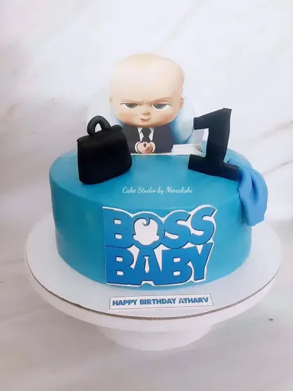 A Boss Baby themed cake for a first birthday. This design is perfect for the little boss of the house, complete with a briefcase and the movie logo.