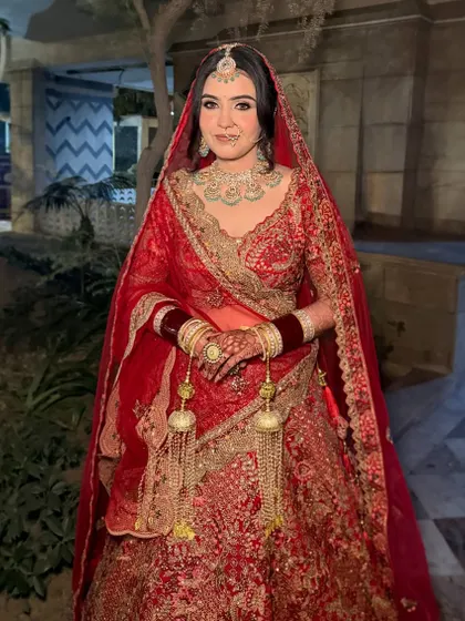 Parul, ready for her pheras. A classic red bridal look with beautifully defined eyes and a radiant complexion.