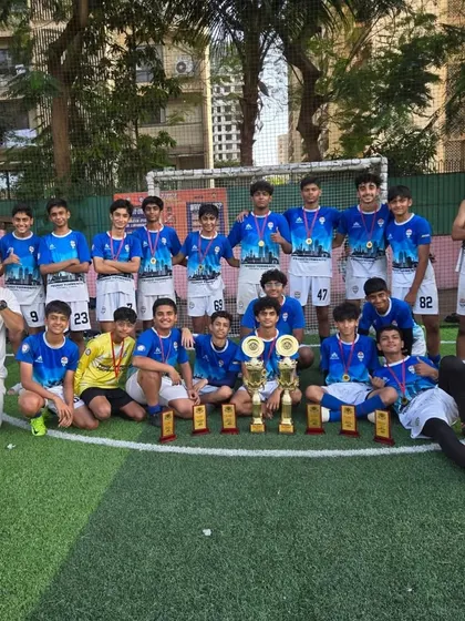A massive group photo of our winning teams and coaches, showcasing the depth of talent at our academy.