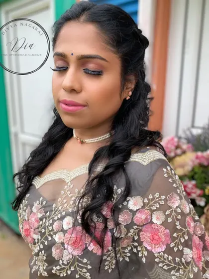 Another angle of the pre-wedding shoot makeup, highlighting the long, fluttery lashes and the glowing skin finish. The soft curls in her hair add to the romantic and dreamy quality of the look.
