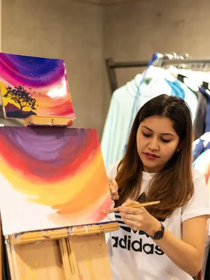 An instructor guiding the group at the Adidas workshop. Even in a busy retail environment, we ensure everyone gets the attention they need to create something they're proud of.