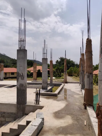 Concrete pillars stand ready on site, mapping out the future corridors and water channels that will define the holiday retreat's ground floor.