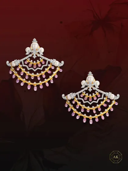 A perfect fusion of modern design and Victorian charm, these earrings are crafted with multi-rows of ruby briolettes, sparkling diamonds, and lustrous South Sea pearls.