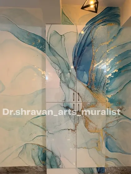 Achieving an alcohol ink effect with normal paints is tough, but I was thrilled with this result. The flowing, translucent layers of blue and gold create a beautiful, ethereal abstract mural.