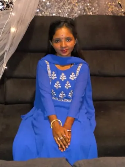 A happy customer posing in our theatre. Her smile says it all.