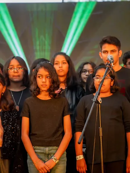 Our choir team, a mix of different ages and voices, performing together at the annual showcase. It’s a beautiful display of the community we've built.
