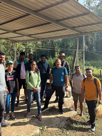 The team, geared up and ready to begin their trek from the Agumbe campsite. I ensure everyone is prepared for the day's adventure.