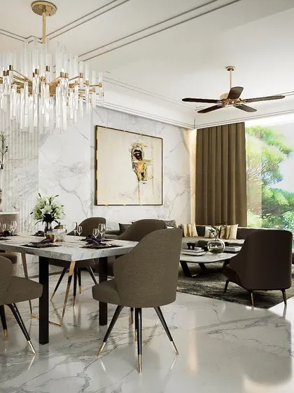 This living and dining space, designed for a jewellery manufacturer, fuses contemporary and classic styles. We used imported marble and a dramatic chandelier to create a setting of bespoke luxury that opens up to a landscaped view.