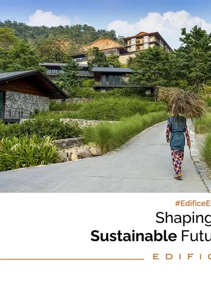 A powerful image of a local woman walking along a path at the Taj Rishikesh site, symbolizing the harmony between our projects and the communities they inhabit. Our ethos is to shape a sustainable future for both people and the planet.