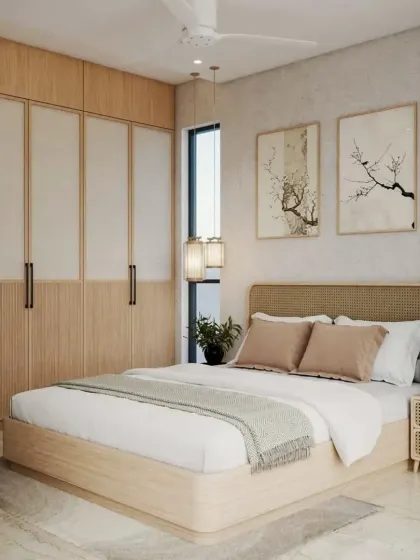 We love working with natural materials to create a calming atmosphere. This bedroom features a Japandi-inspired design with a light wood and cane bed, matching wardrobe, and minimalist artwork.