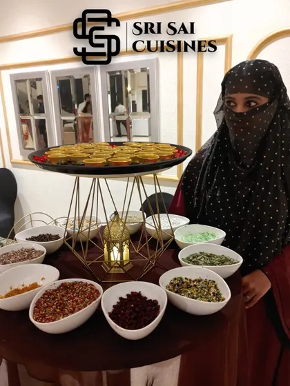 A close-up of my Irani Paan Mukhwas Station. A hostess presents a tray of freshly made paan, surrounded by bowls of various sweet and savory mouth fresheners.