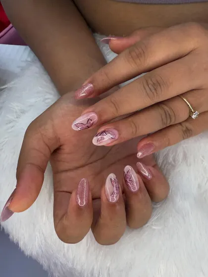 A delicate and ethereal butterfly design. The soft, sketch-like butterflies are painted on a sheer, shimmery pink base for a dreamy and romantic feel.