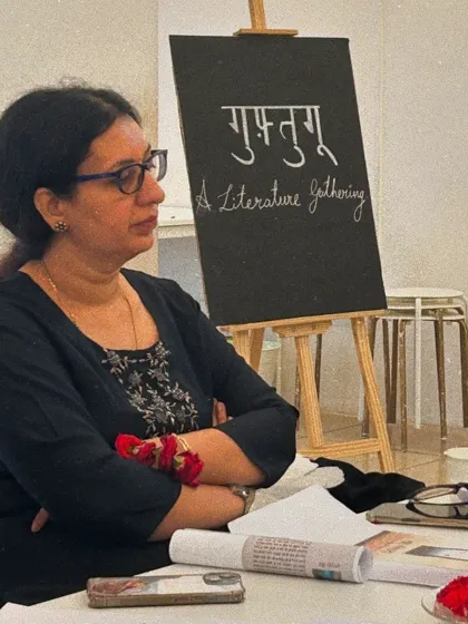 A member of the group listens intently to a reading, showcasing the focused atmosphere of our literary events.