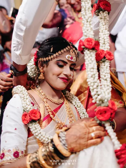 A close up of the bride, Teja, during the mangalsutra ceremony. Her serene expression is full of emotion.