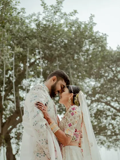 A tender moment between the bride and groom, lost in their own world. These are the quiet, romantic shots that balance the energy of the wedding day.