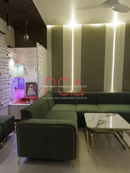 The living room and integrated pooja (prayer) unit in The Cursive Abode, showing how spiritual spaces can be seamlessly incorporated into modern living areas.