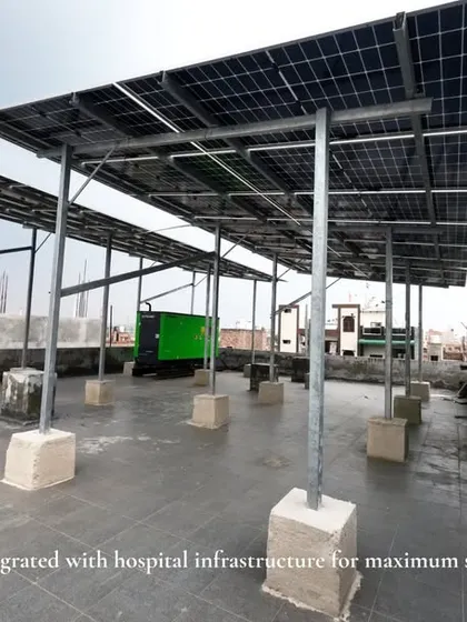 An elevated solar panel structure at Jivaasha Neo Hospital. This custom design ensures the hospital can still use the rooftop area for other equipment.
