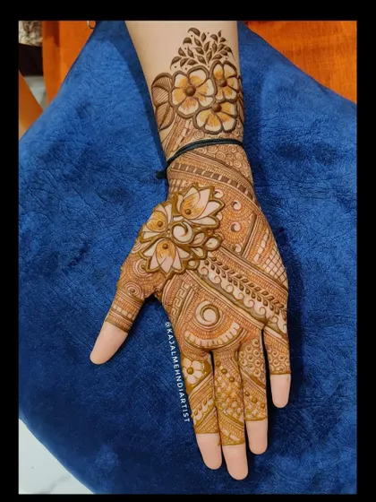 A beautiful Indian henna design with a central lotus motif.