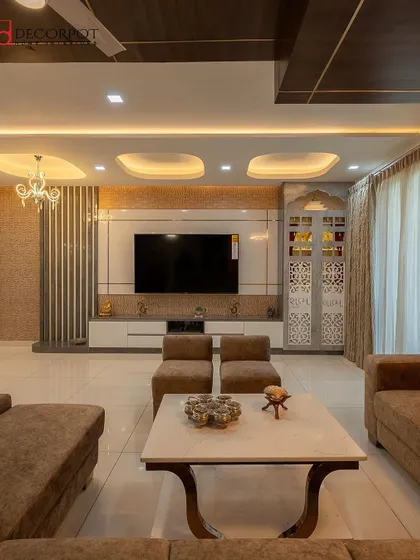 This grand living room features a TV unit integrated into a wall with multiple textures, including fluted panels and a CNC-cut partition. The neutral color palette creates a sophisticated and cohesive look.