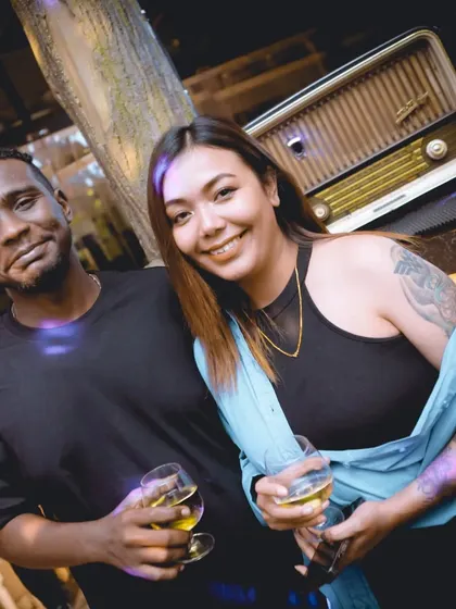 A couple enjoying the vibe at the bar. My parties are for everyone who loves good music.