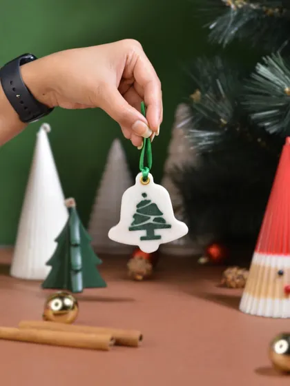 A close-up of my bell-shaped scented Christmas ornament. This wax sachet can be hung on your tree to add a festive scent that looks as good as it smells.