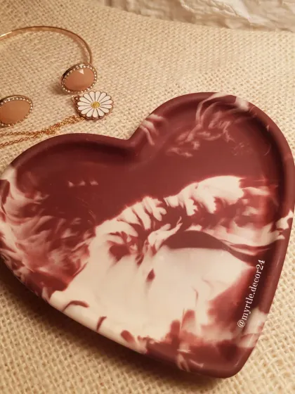 A close-up of the beautiful, fluid patterns in our 'Aurora' heart tray. No two are ever the same, which is the magic of handmade.
