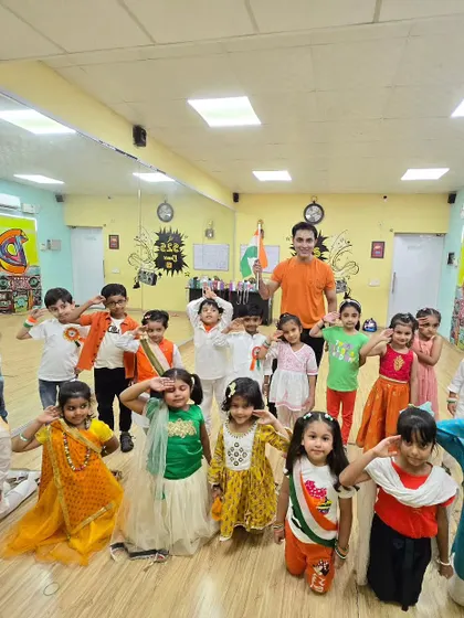 Celebrating Independence Day at the studio. The kids are dressed in tricolor themes, ready to perform a patriotic dance.