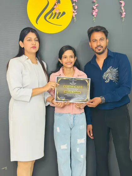 A happy student receiving her certificate at the Rajasthan workshop.