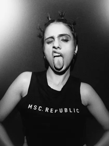 An expressive and rebellious black and white portrait. This shows a fun and fearless side of the model's personality.