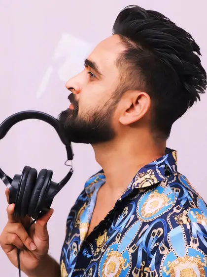 Holding up the tool of my trade. My headphones are my connection to the beats that get you dancing.