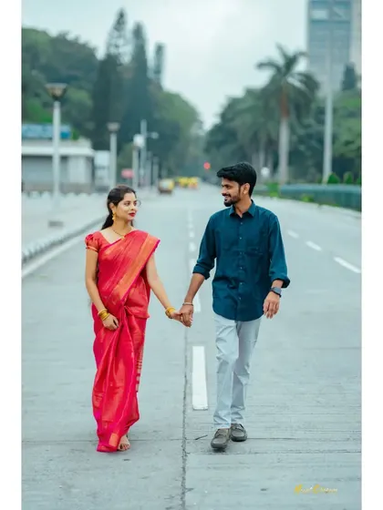 A couple walks hand-in-hand down an empty city street, creating a feeling that they are in their own world. A beautiful shot for a Bangalore-based pre-wedding story.