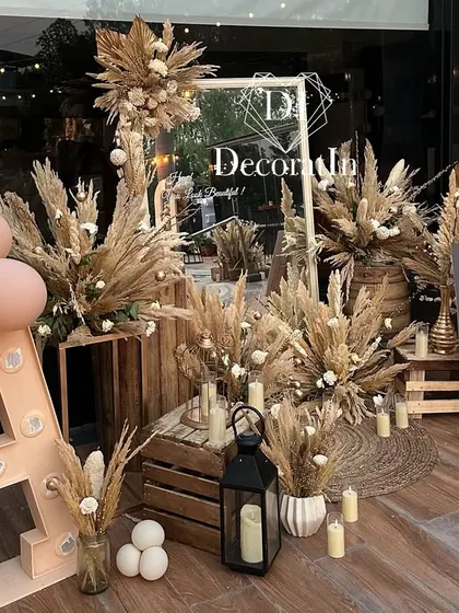 A slightly different angle of the rustic mirror corner, showing the "Damn! 40" sign and the intricate arrangement of pampas grass and props.