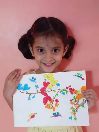 The joy of creating starts early at our academy. This is Ira, a 2nd standard student from one of our online classes, with her beautiful and colorful finger painting of birds and flowers.