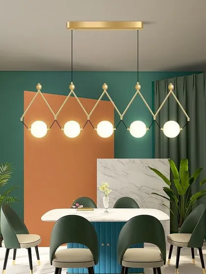 This geometric pendant light with five globes is perfect for a modern dining room. The gold finish adds a touch of warmth and luxury.