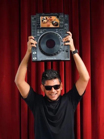 A fun promotional shot showing off the tool of my trade, the Pioneer CDJ. This is the heart of my performance setup.