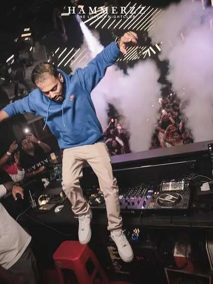 Jumping on the console at Hammerzz is a signature move. It's about breaking the barrier and becoming one with the crowd.