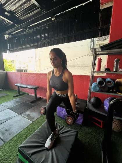 Using dumbbells for a split squat on a plyo box, this variation challenges balance and control.