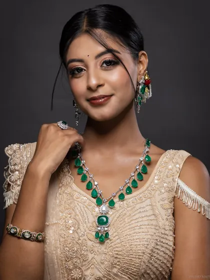 A classic portrait of the model showcasing her emerald necklace.
