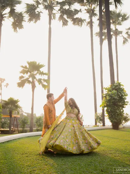 A dreamy, sun-flared shot of the couple dancing. These are the magical moments that make a wedding so special.