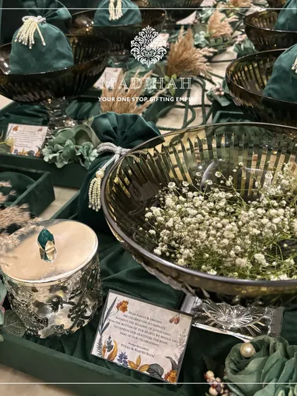 My Crystal Elfin Hampers are designed to bring magic to your wedding. This arrangement in deep green velvet features crystal bowls, silver-finished jars, and custom floral details for an enchanting look.