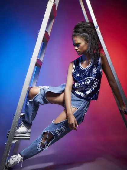 Another creative pose on the ladder for Diseno.in, showcasing the distressed denim and sequined top.