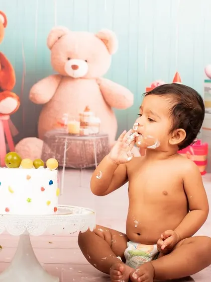 Getting a little messy is part of the fun. This shot captures the joy of a baby enjoying their first birthday cake.