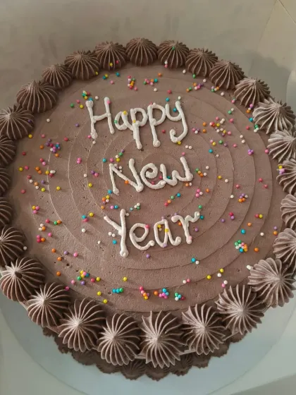 A classic chocolate cake to celebrate the New Year. I've topped this one with colorful sprinkles for a fun and festive look that's perfect for any party.