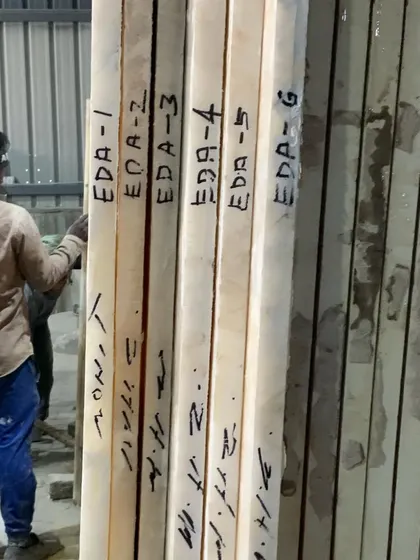 These marble slabs are marked with "EDA" for Elite Design Architects, ready to be transported to the site. I manage the entire procurement and selection process to guarantee the quality of materials used in your home.