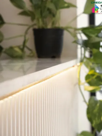 Detail of the warm, indirect lighting that adds a touch of luxury and highlights the clean finishes.