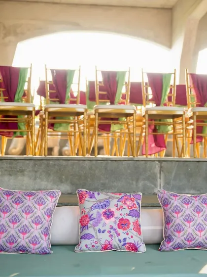 A detail shot of the custom cushions and the guest seating in the background.